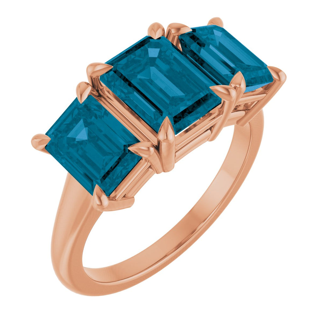 8x6 mm Emerald Natural London Blue Topaz Three-Stone Ring in 14k rose gold