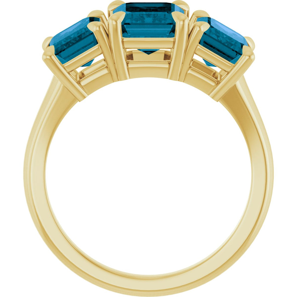 8x6 mm Emerald Natural London Blue Topaz Three-Stone Ring in 14k yellow gold