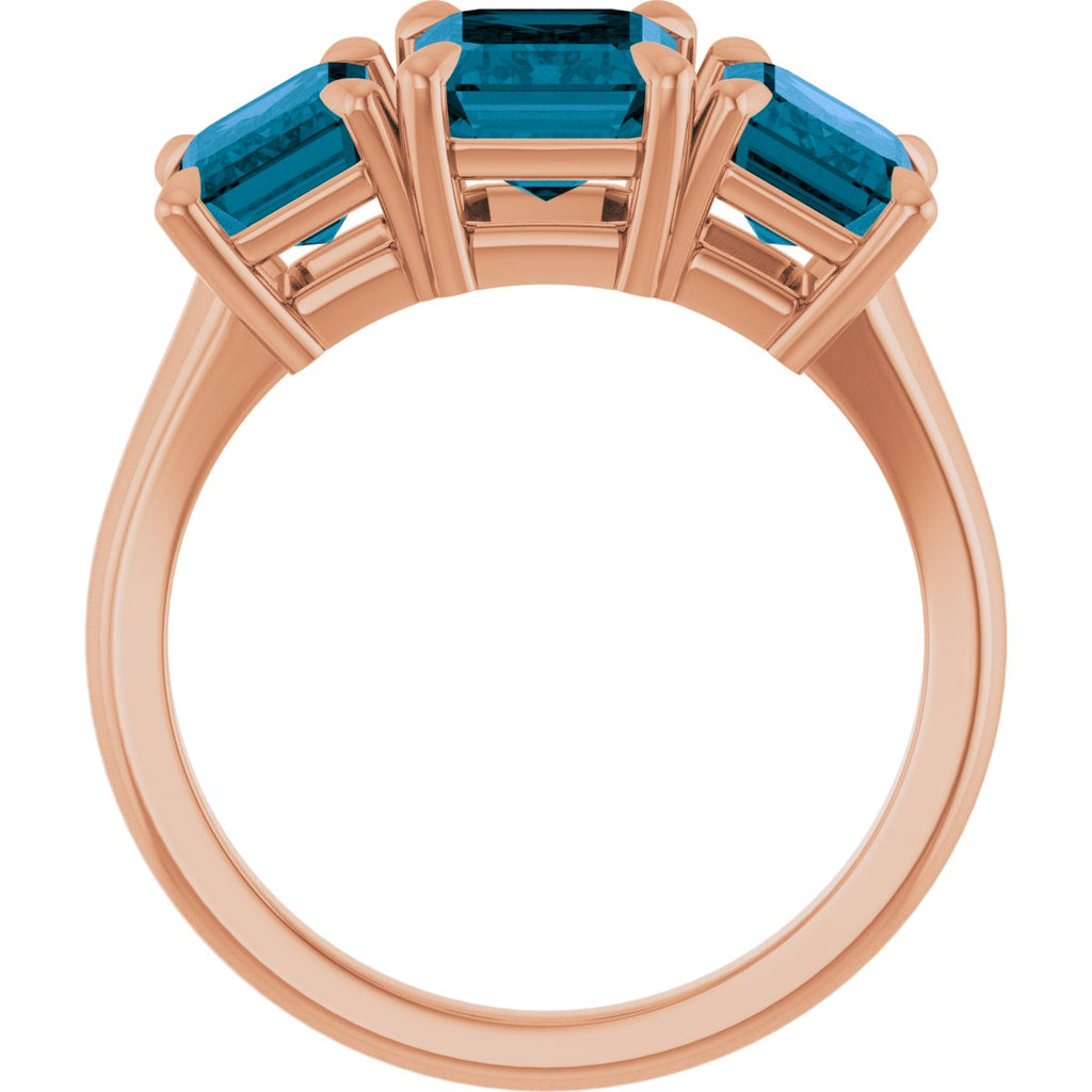 8x6 mm Emerald Natural London Blue Topaz Three-Stone Ring in 14k rose gold