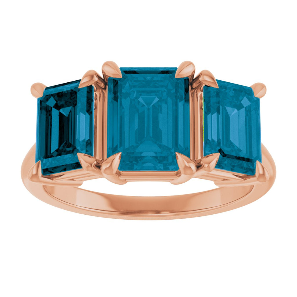 8x6 mm Emerald Natural London Blue Topaz Three-Stone Ring in 14k rose gold