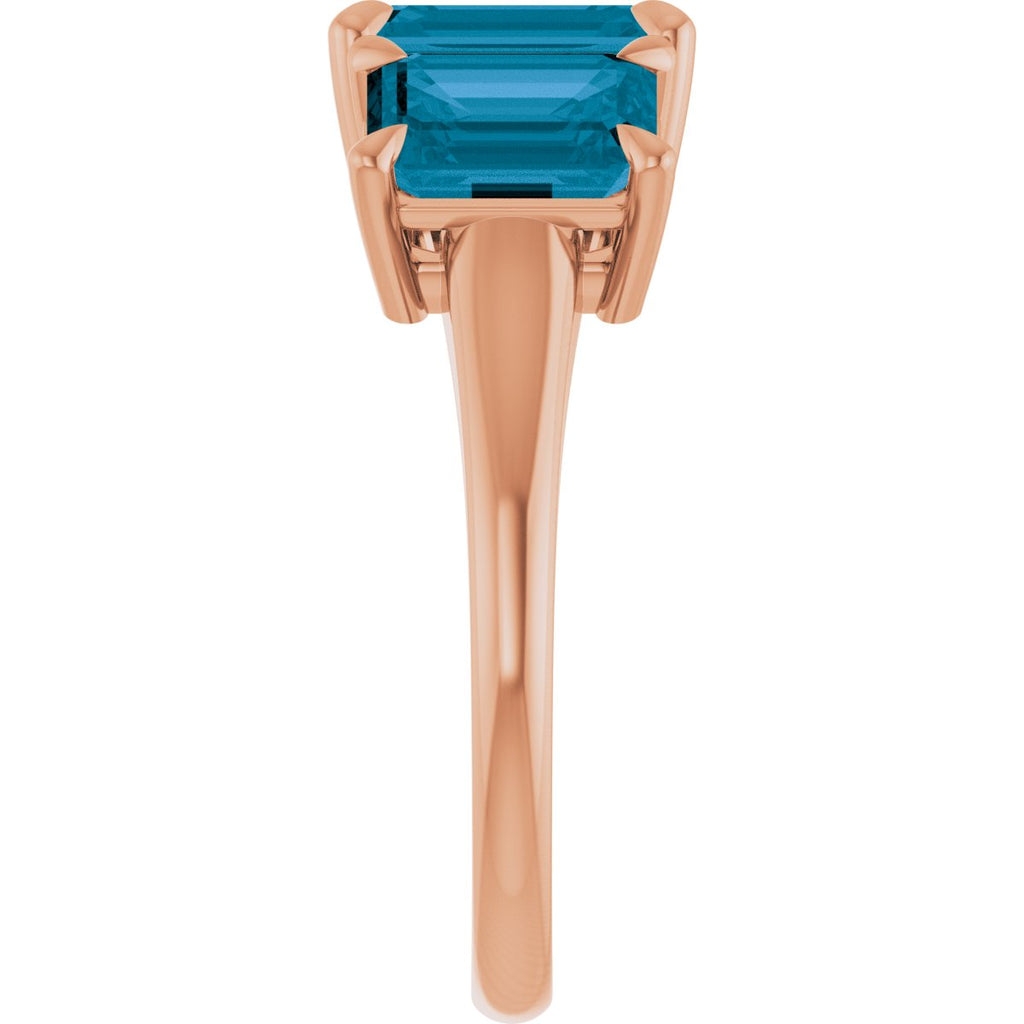 8x6 mm Emerald Natural London Blue Topaz Three-Stone Ring in 14k rose gold