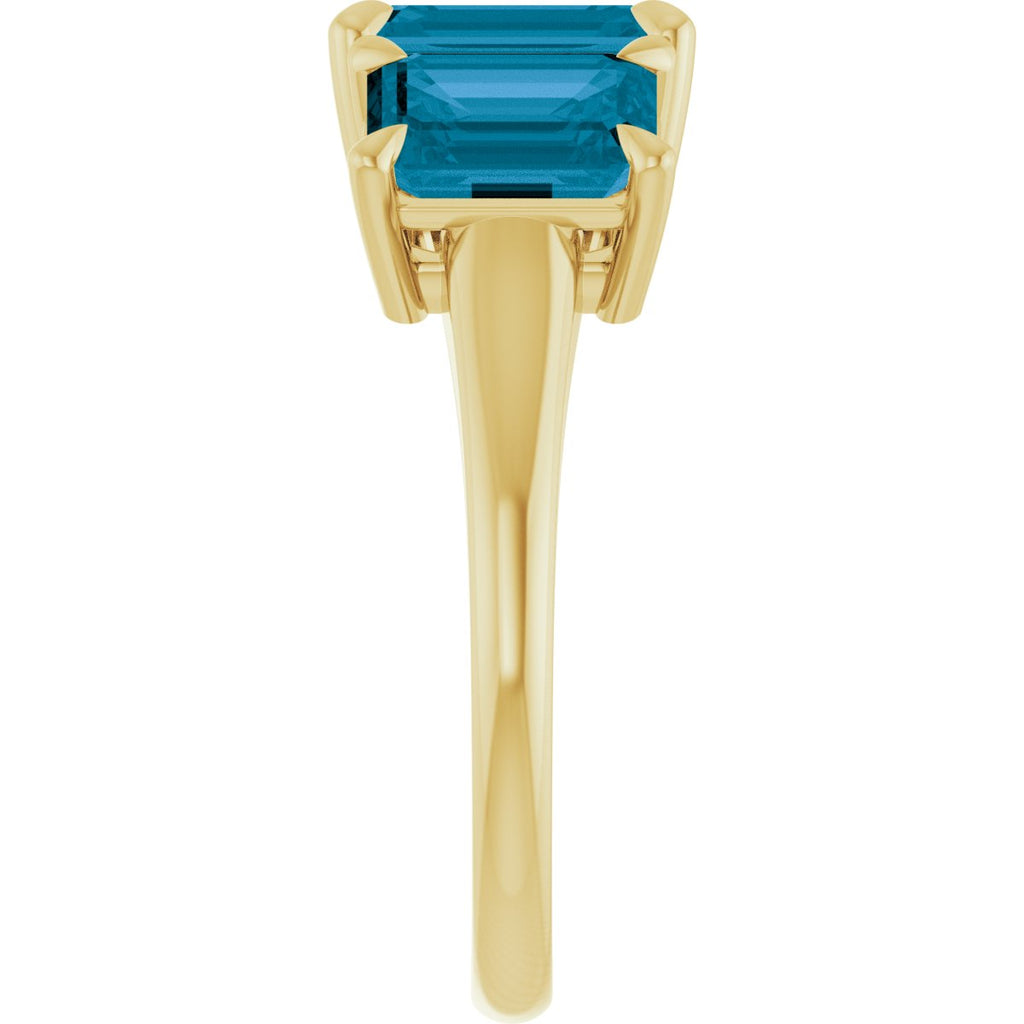 8x6 mm Emerald Natural London Blue Topaz Three-Stone Ring in 14k yellow gold