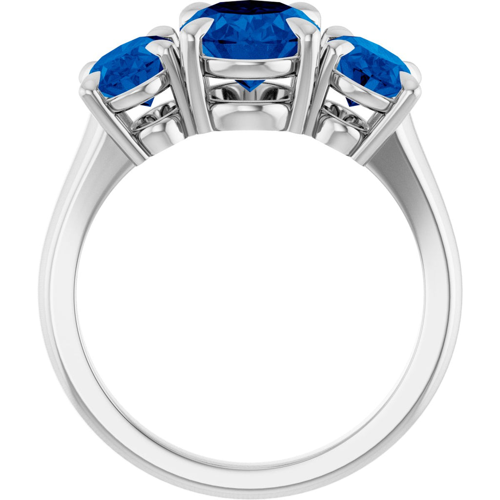 9x7 mm Oval Lab-Grown Blue Sapphire Three-Stone Ring in platinum