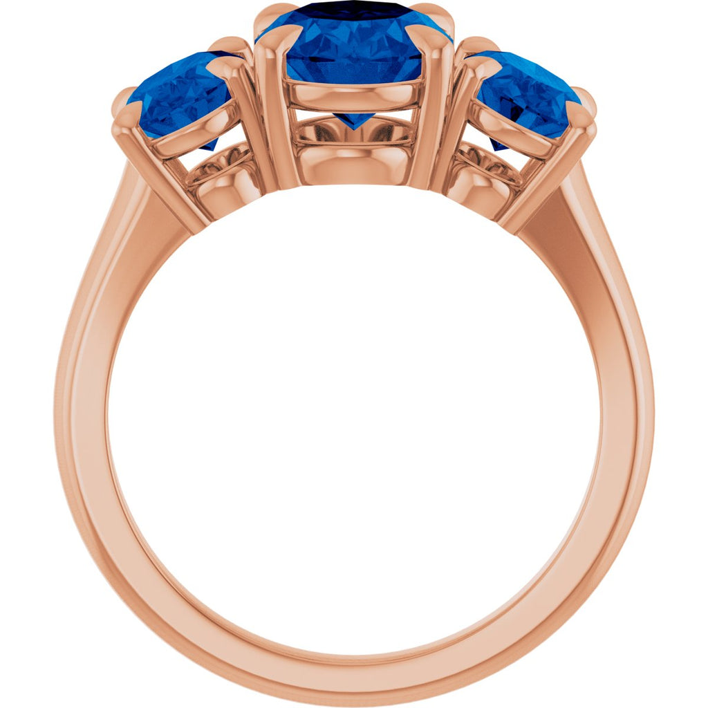 9x7 mm Oval Lab-Grown Blue Sapphire Three-Stone Ring in 14k rose gold