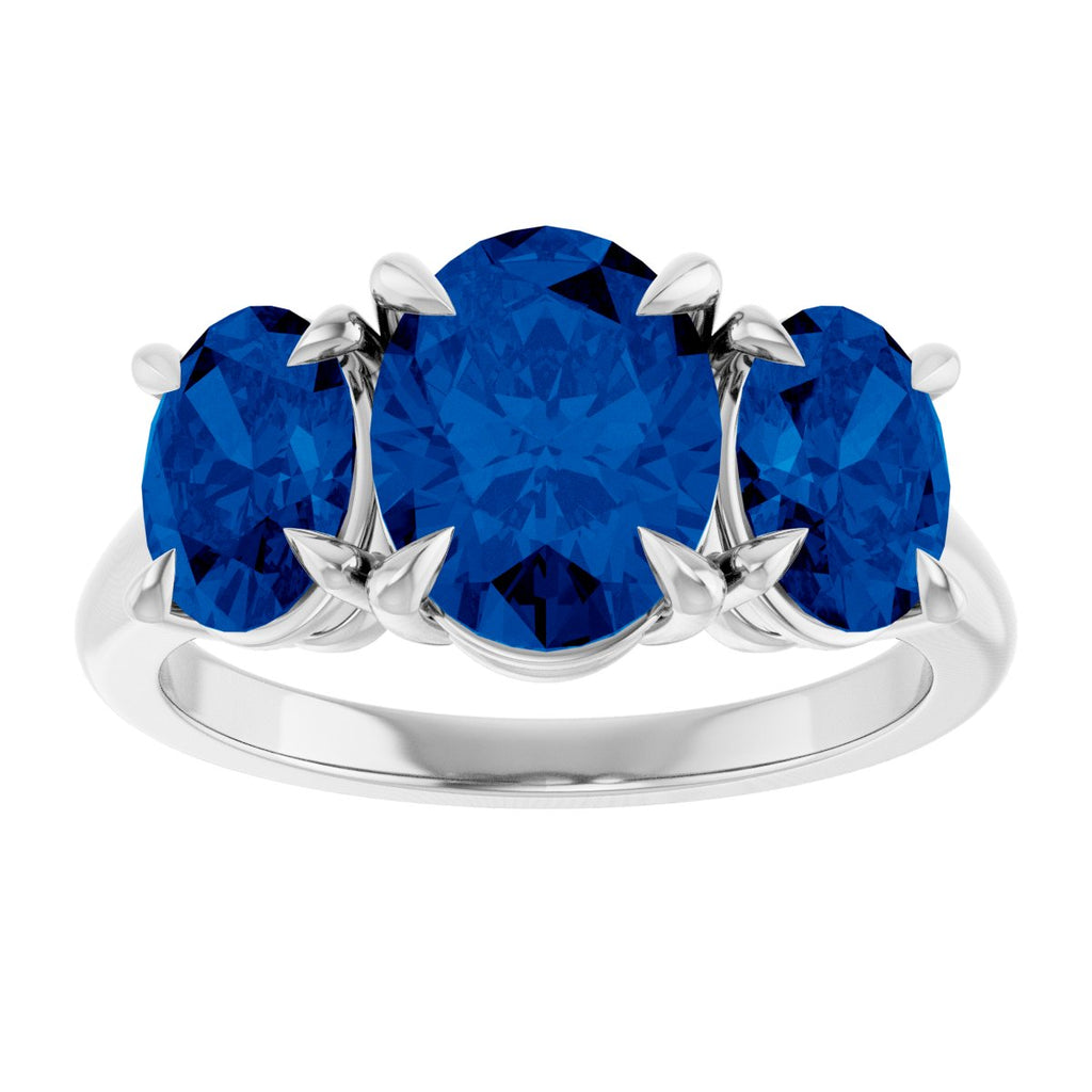 9x7 mm Oval Lab-Grown Blue Sapphire Three-Stone Ring in platinum