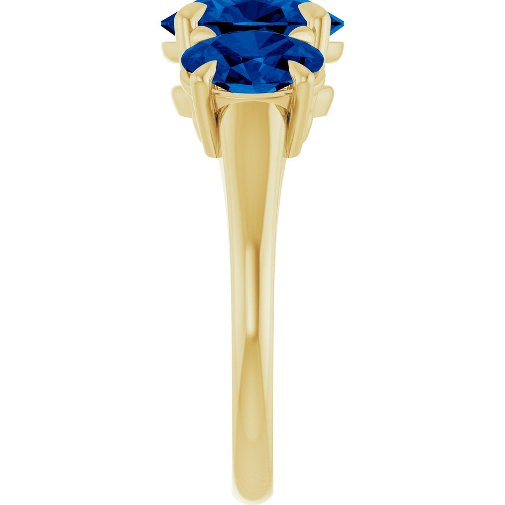 9x7 mm Oval Lab-Grown Blue Sapphire Three-Stone Ring in 14k yellow gold