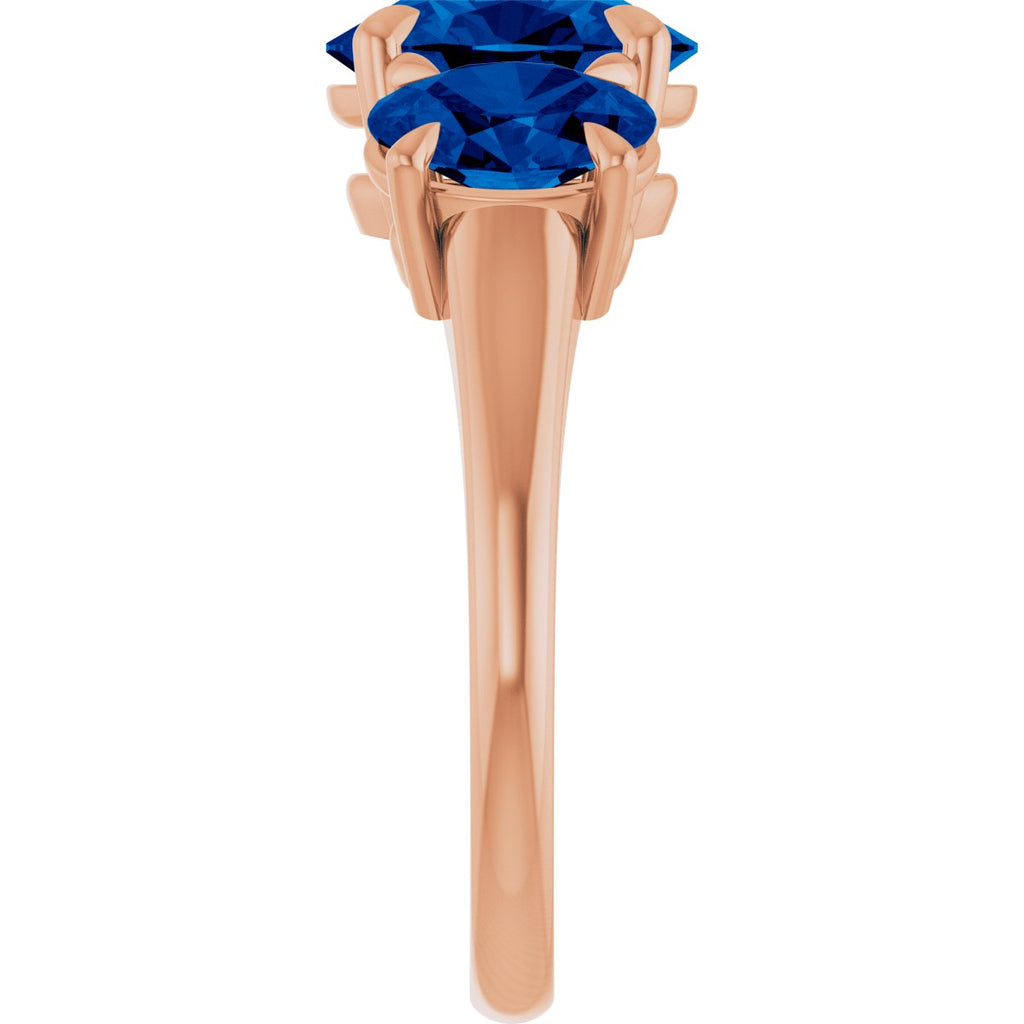 9x7 mm Oval Lab-Grown Blue Sapphire Three-Stone Ring in 14k rose gold